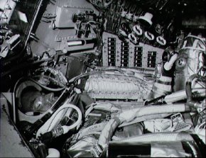 Astronaut L. Gordon Cooper Jr.,prime pilot for the Mercury-Atlas 9 mission, inside his Mercury spacecraft runs through one of the numerous pre-flight checks surrounded by dials, switches, indicators and buttons.
